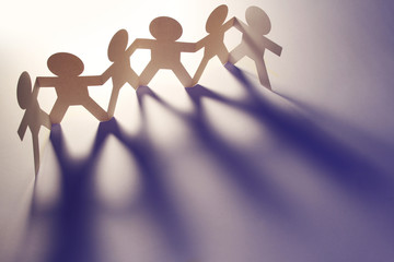 Paper chain team holding hands