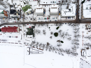 Top view of Lappeenranta city with snow covered houses at urban embankment. Aerial view at Kaupunginlahti gulf of Saimaa lake. Finland, Europe