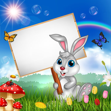 Cartoon rabbit holding blank sign with nature background