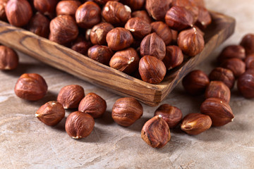Hazelnuts in old wooden dish
