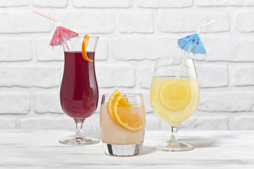 Various cocktail glasses are together.
