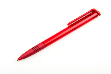 red ballpoint pen on a white background