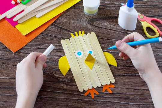The child draws details of gift items. Children's Easter gift toy chicken and Easter bunny. Hand-made. The project of children's creativity, needlework, crafts for children.