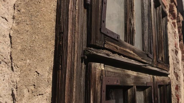 Old abandoned house weathered window details 4K 2160p 30fps UltraHD footage - Wood and glass broken with destructed building facade 3840X2160 UHD video 