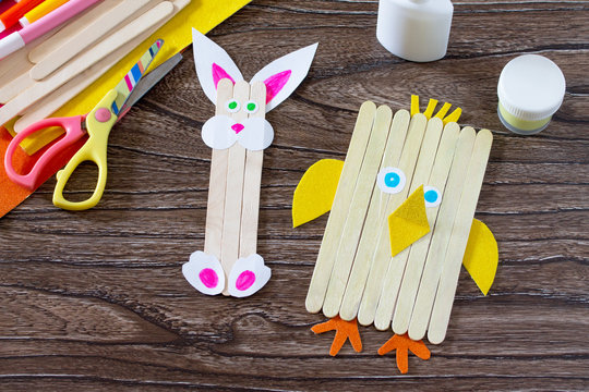 Children's easter gift from wooden chopsticks toy chicken and Easter bunny. Hand-made. The project of children's creativity, needlework, crafts for children.