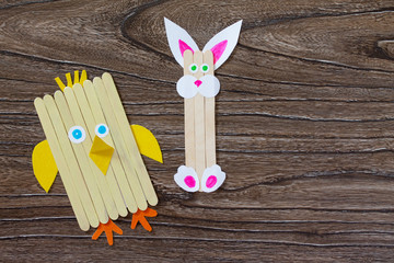 Fototapeta na wymiar Created by the child an Easter toy from the chickens Easter chicken and rabbit. Made by hand. The project of children's creativity, needlework, crafts for children.