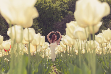Gorgeous woman in tulip field