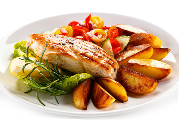 Grilled chicken fillet, chips and vegetable salad 