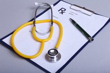 RX prescription, Red heart and a stethoscope on white background