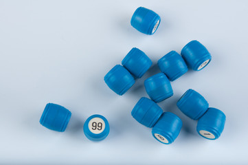 Pile of plastic lotto kegs lay on white background