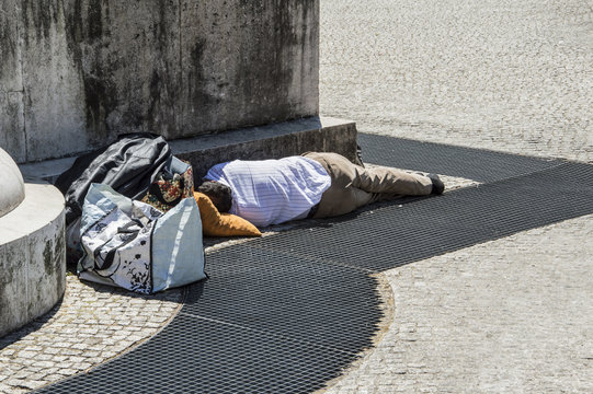 Fired businessman, unemployment sleeping on the street in waiting for a job