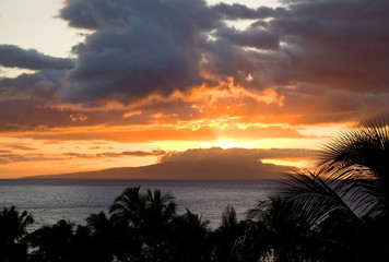 Fototapeta na wymiar Sunset across distant island (Lanai) from Maui
