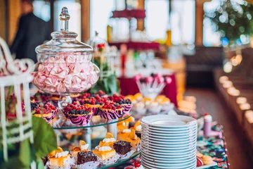 Rolgordijnen Delicious sweets on candy buffet. Lot of colorful desserts on table. © nataliakabliuk