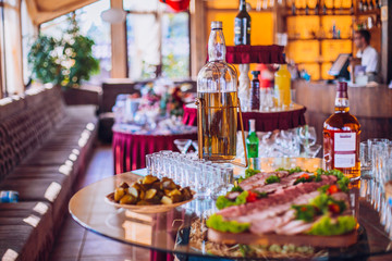 Buffet table of reception with cold snacks, meat and ham
