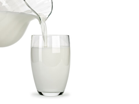 Filling of a glass by milk from a glass jug