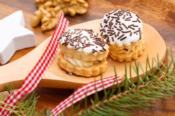 Christmas sweets on a wooden spoon