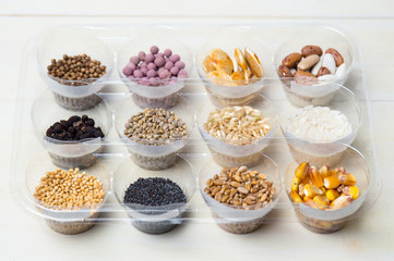 Various seeds in plastic bowls