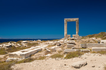 Apollo Temple entrance, Naxos island, Cyclades. Seascape of the island of Naxos, Greece. The most famous Greek view. famous Gate on the island of Naxos. Arch of the Ancient Temple

