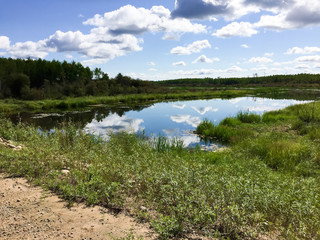 Fototapeta na wymiar Sky reflecting on a river in northern Saskatchewan