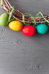   Easter concept .  eggs and wreath on a wooden background