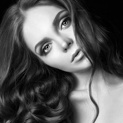 Fototapeta premium Sexy beautiful redhead girl with long hair. Perfect woman portrait on black background. Gorgeous hair and deep eyes. Natural beauty, clean skin, facial care and hair. Strong and thick hair