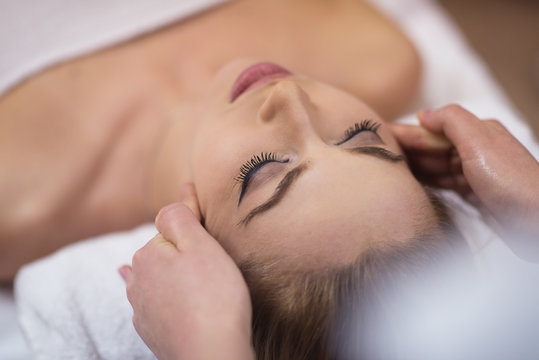 woman receiving a head massage