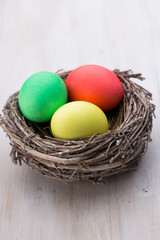 Obraz na płótnie Canvas Easter eggs in the nest. Spring discount card.