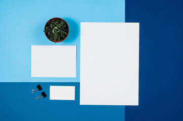 Mock-up magazine or catalog on colorful table. White page or notepad on modern background. Blank copy space for mockups or simulations.