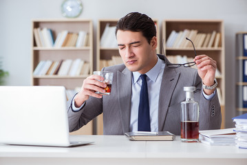 Businessman drinking in the office