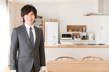 portrait of asian businessman in kitchen