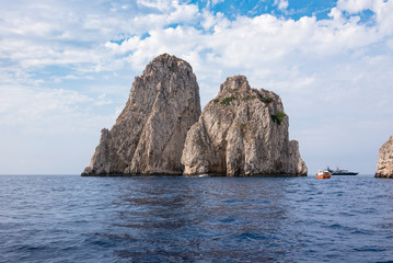 Fototapeta na wymiar Faraglioni rocks at Capri Island coast