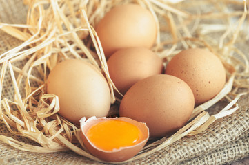 Eggs over jute sack background. Happy easter.