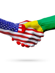 Flags United States and Guinea countries, partnership handshake.