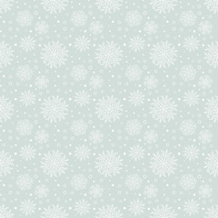Winter light blue and white pattern with small and big snowflakes. Seamless abstract background