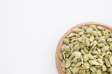 Pumpkin seeds on white background