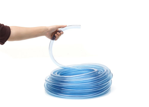 Hand Holding Transparent Plastic Water Hose Isolated