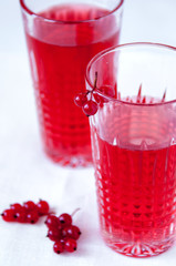Drink red currant in a beautiful transparent glass