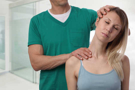 Chiropractic, osteopathy. Therapist doing healing treatment on woman's neck . Alternative medicine, pain relief concept. Physiotherapy, sport injury rehabilitation