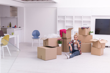 Fototapeta premium woman with many cardboard boxes sitting on floor