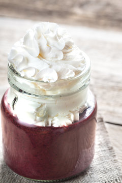 Bilberry smoothie with whipped cream