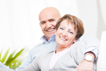 Laughing happy affectionate middle-aged couple