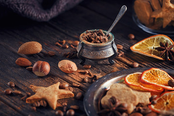 Homemade gingerbread cookies, spices and decorations
