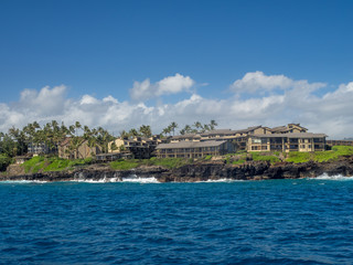 Condominiums along the ocean at Poipu, Kauai. 