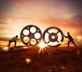 Cooperation at work concept with gears mechanism - obrazy, fototapety, plakaty