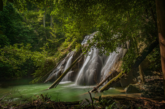 Fototapeta Batanta Island Waterfall, Indonesia. After a one hour hike through rain forest you come to spectacular 60+ meter waterfall located on Batanta Island in the Raja Ampat area of West Papua, Indonesia. 