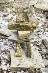 Rugged pile of rocks and flat stones arranged carefully into a meditation tower, balance of spirit concept