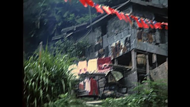 Old wooden houses of Hong Kong skyline. Historic restored footage on 1980s with old buildings.