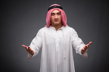 Arab businessman on gray background