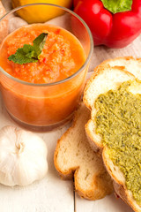 Tomato gazpacho soup with herbs in a glass
