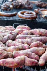 Baked Sweet Potato and northern Thai sausage,Thai dessert,street food. In Thailand it is a standard food of the northern provinces and it has become very popular in the rest of Thailand as well.